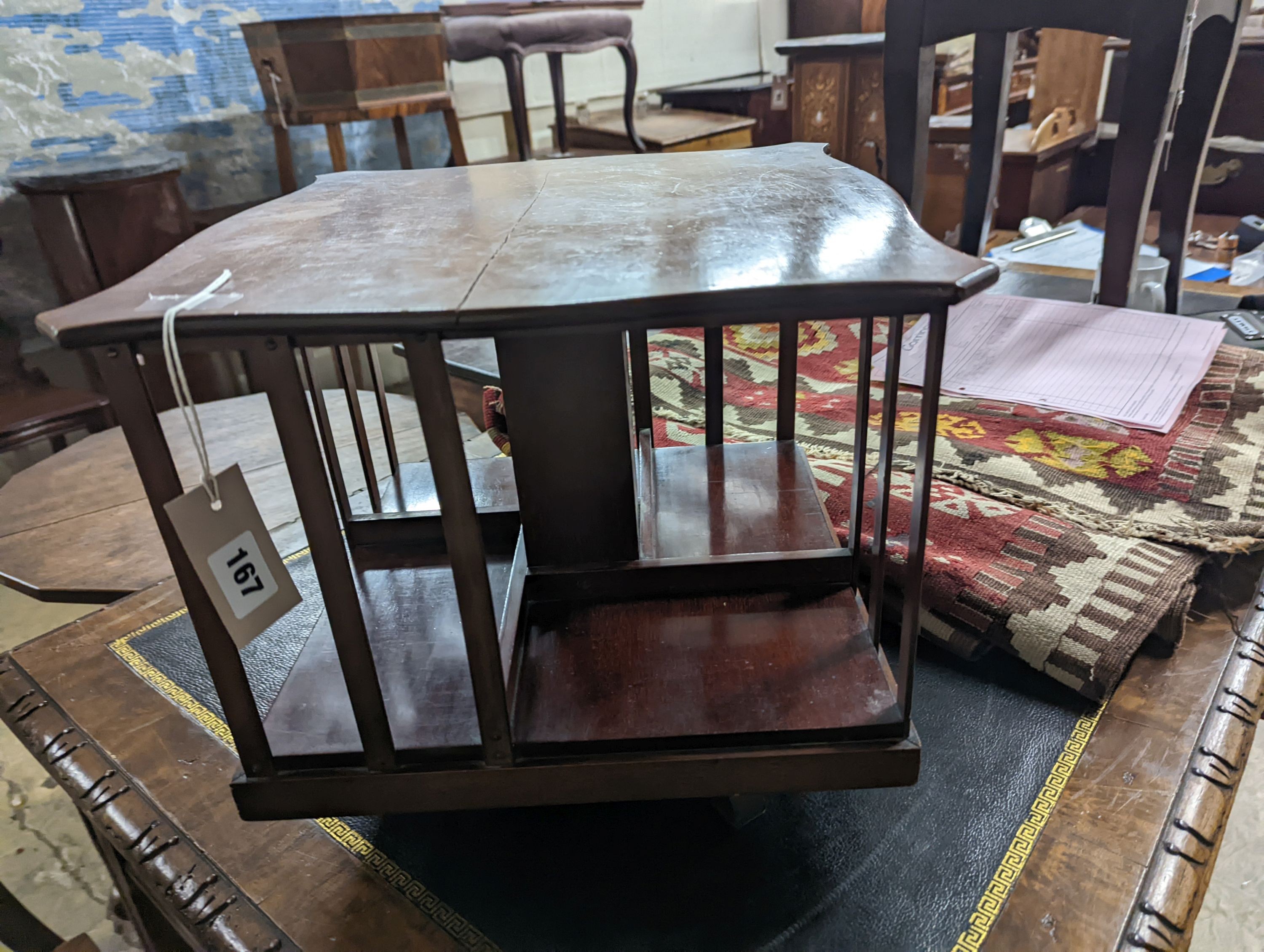 A late Victorian table top revolving bookcase, width 37cm, height 32cm